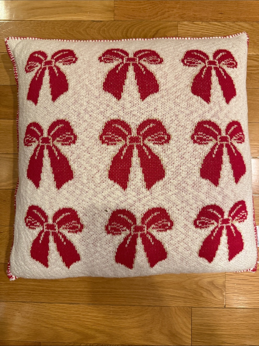 cupcakes & cashmere Red Bow Pattern Knit Holiday Pillow